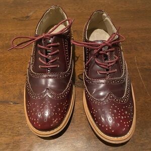 Brown wingtip shoes.